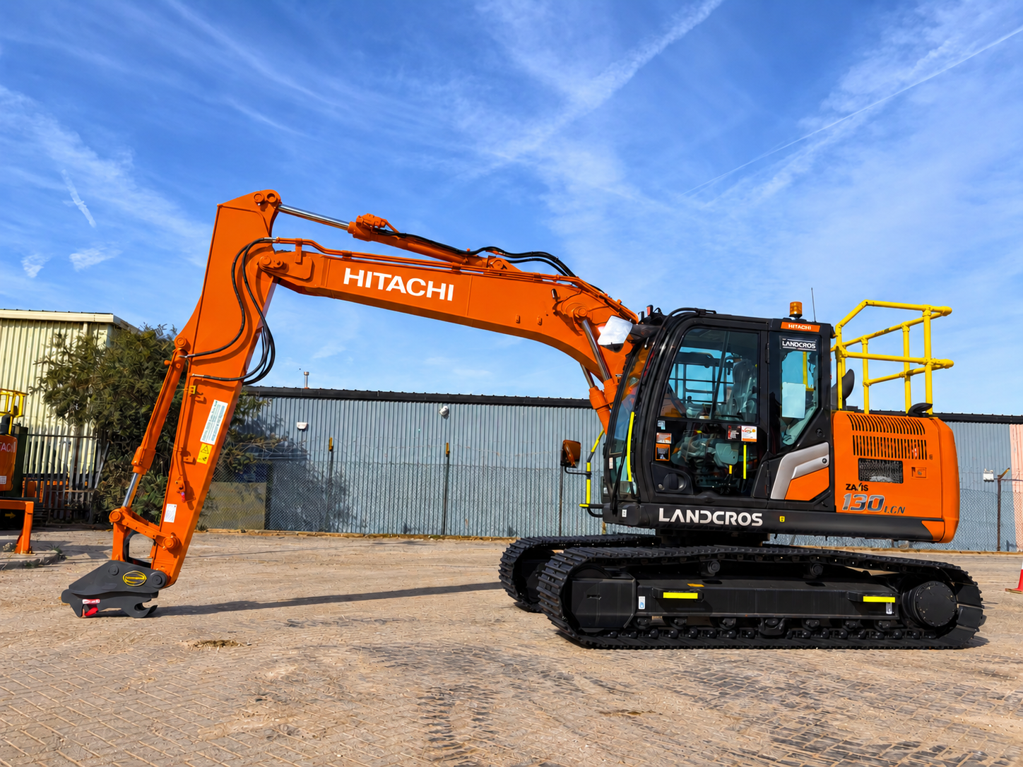 Hitachi ZX130LCN-7B excavator in Synergy Hire depot yard, side profile